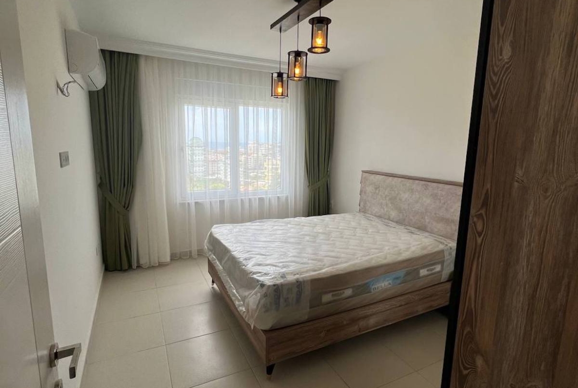 квартира 1+1 с панорамным видом в районе Махмутлар