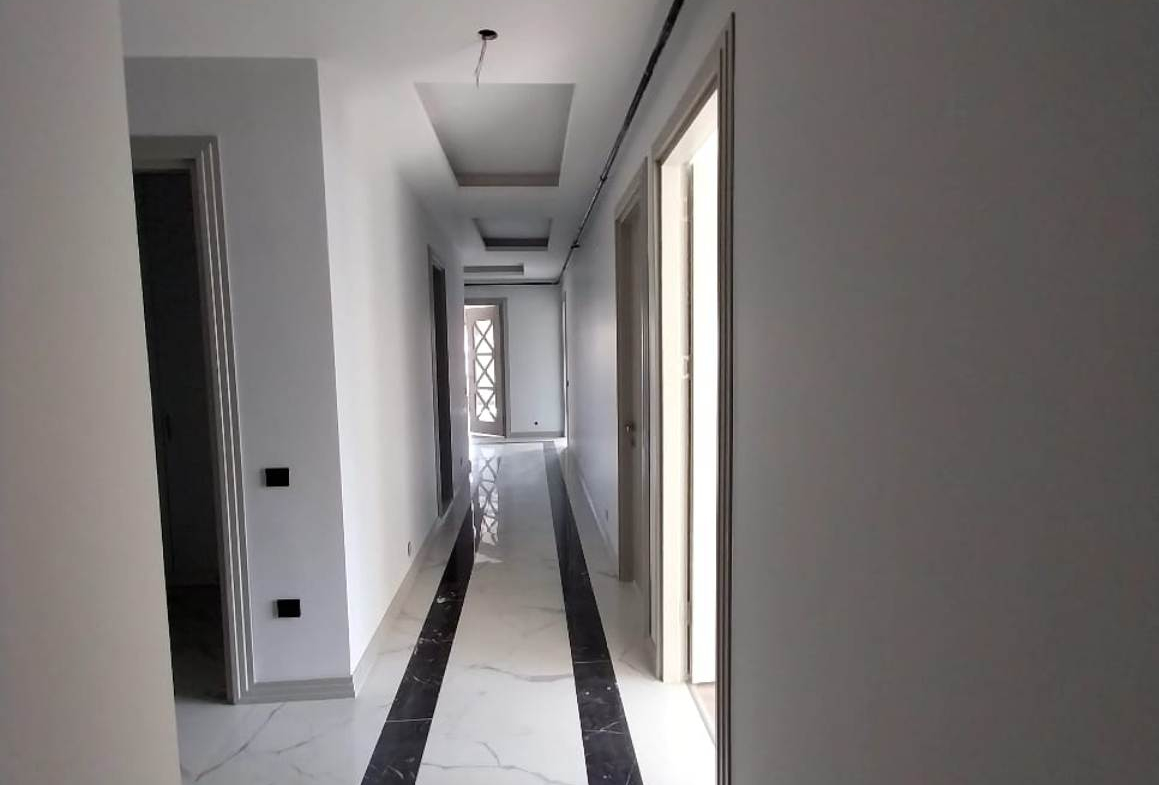 Квартира 5+1 от застройщика в сданном доме в Мерсине