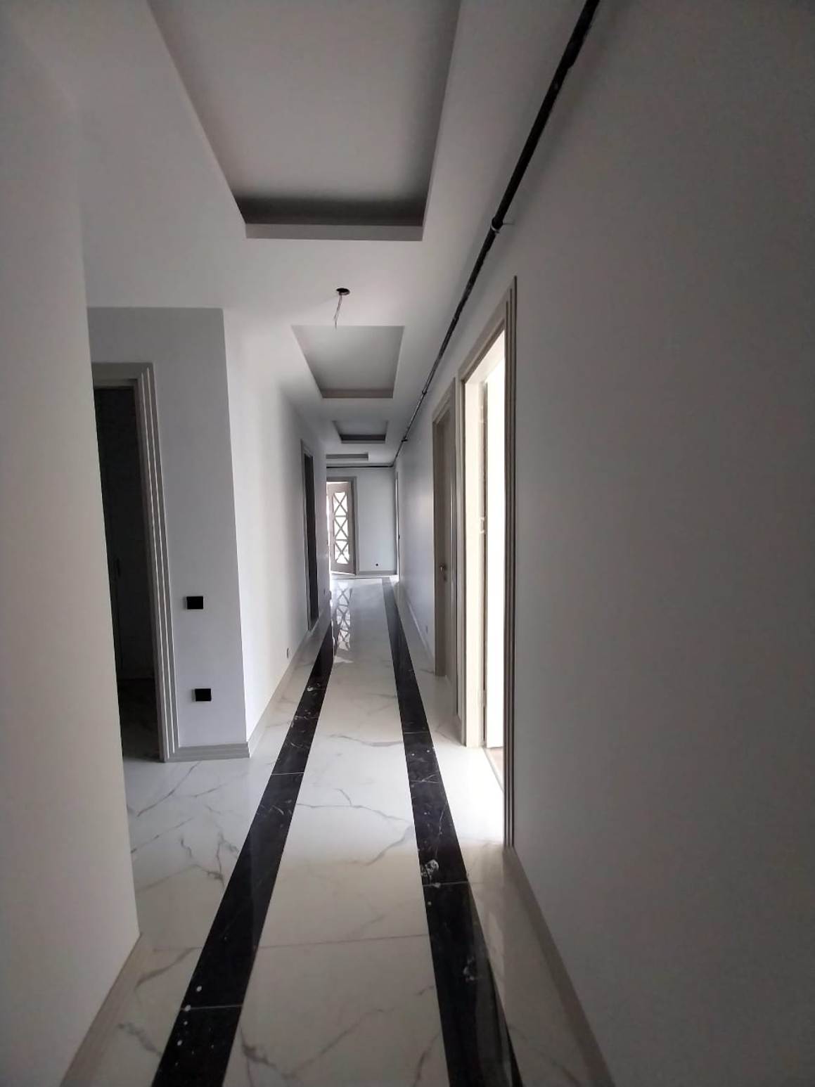 Квартира 5+1 от застройщика в сданном доме в Мерсине