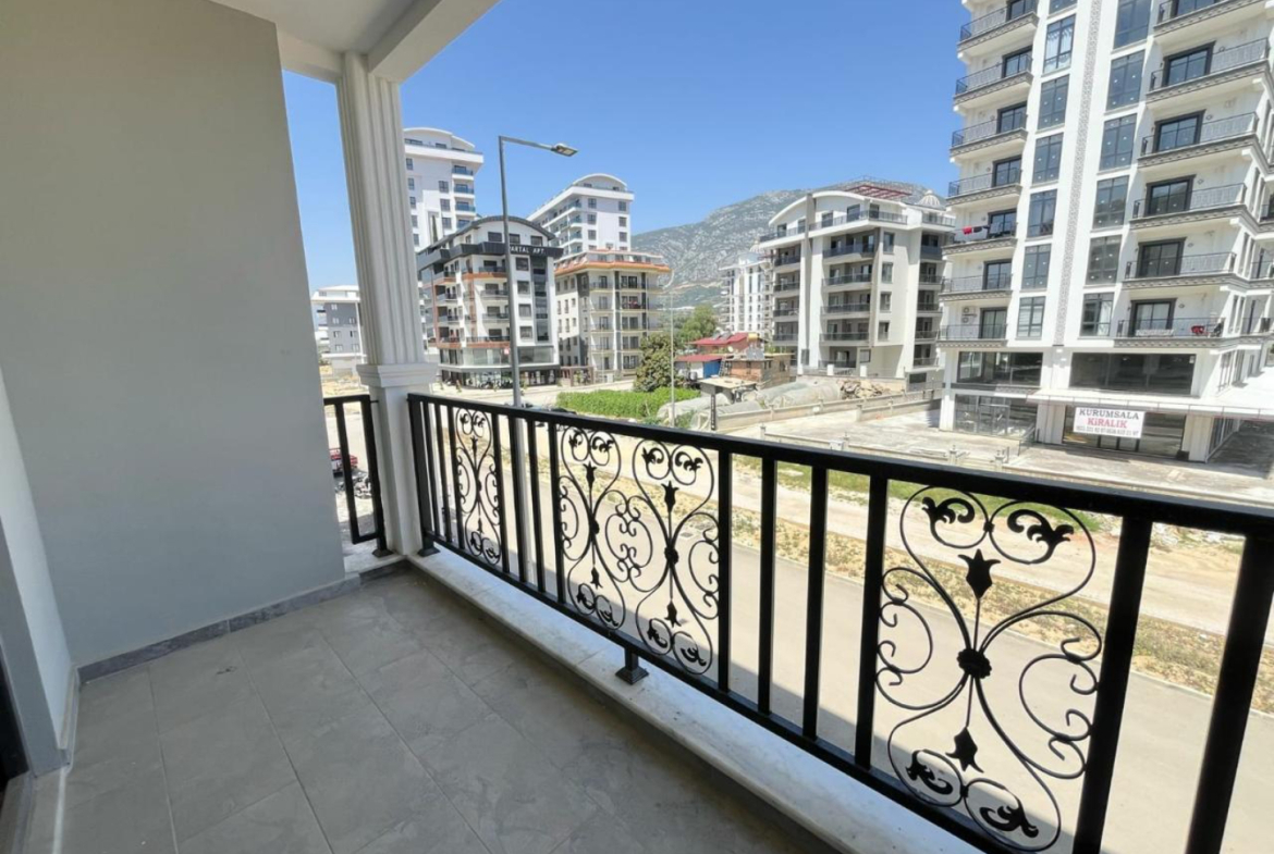 квартира 1+1 с отделкой в районе Махмутлар