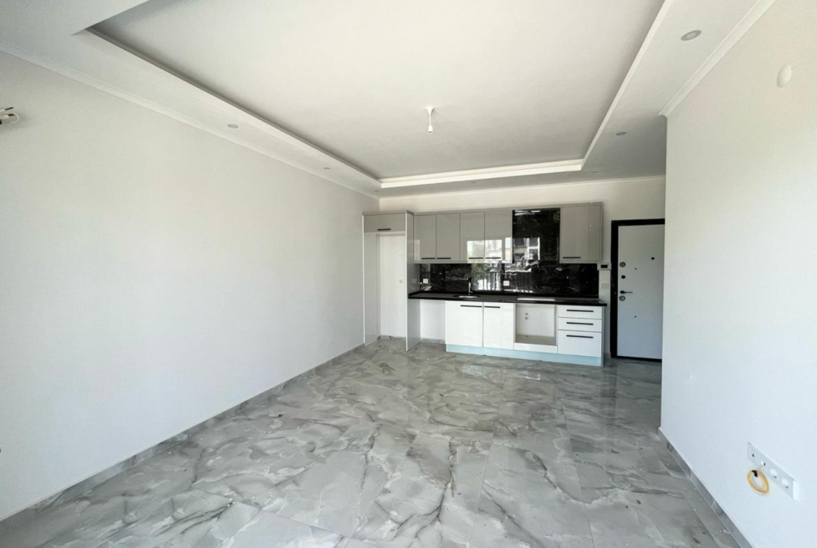 квартира 1+1 с отделкой в районе Махмутлар