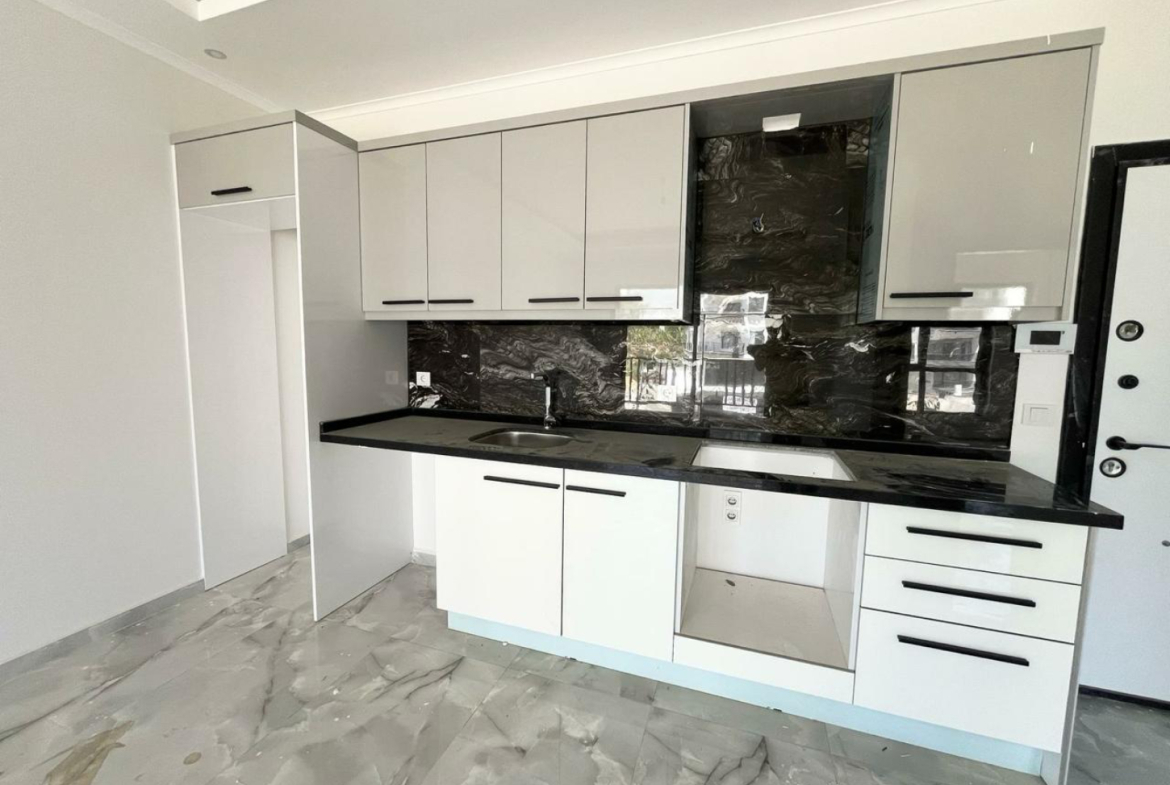 квартира 1+1 с отделкой в районе Махмутлар