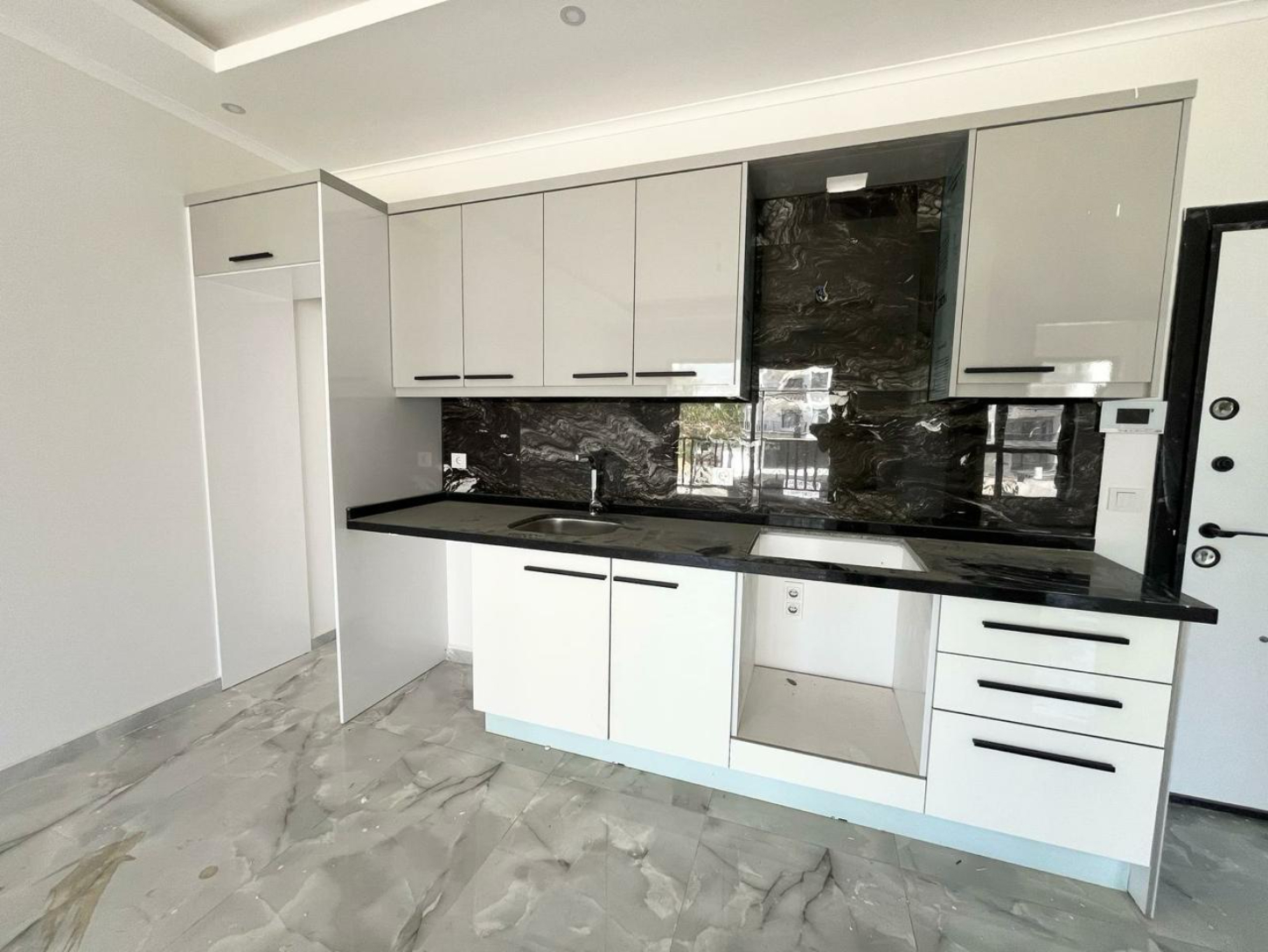 квартира 1+1 с отделкой в районе Махмутлар