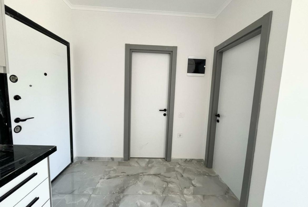 квартира 1+1 с отделкой в районе Махмутлар