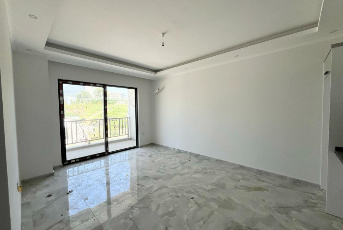 квартира 1+1 с отделкой в районе Махмутлар