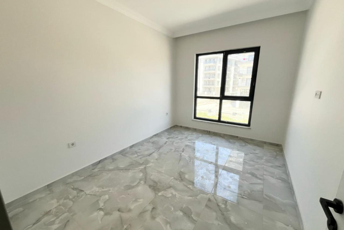 квартира 1+1 с отделкой в районе Махмутлар