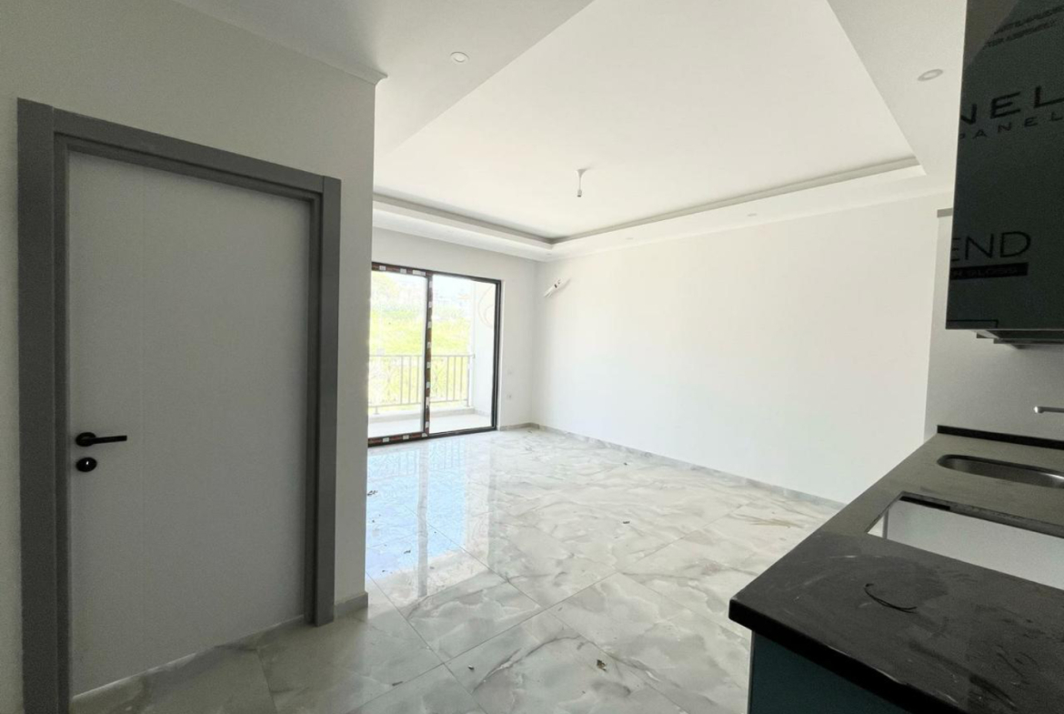 квартира 1+1 с отделкой в районе Махмутлар