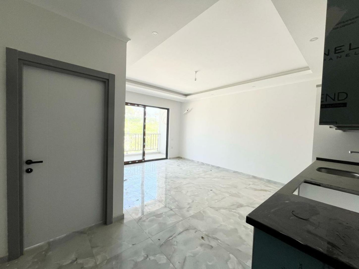 квартира 1+1 с отделкой в районе Махмутлар