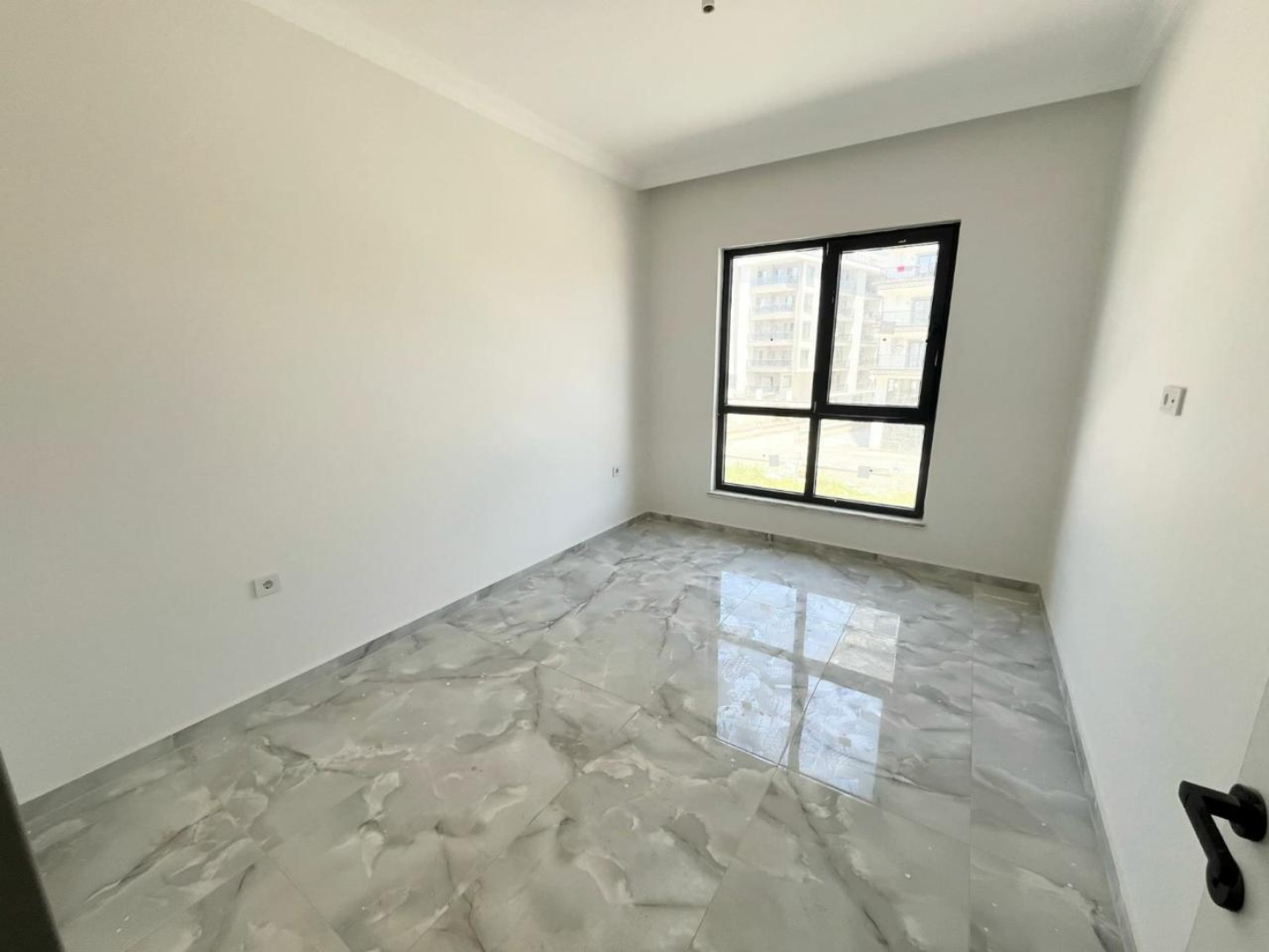 квартира 1+1 с отделкой в районе Махмутлар