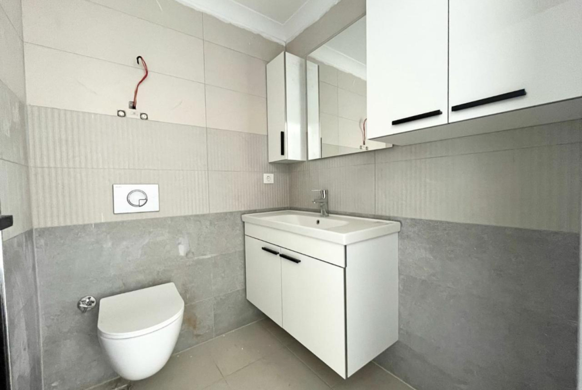 квартира 1+1 с отделкой в районе Махмутлар