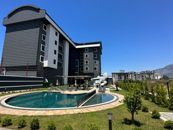 продажа квартиры 1+1 возле моря, Аланья