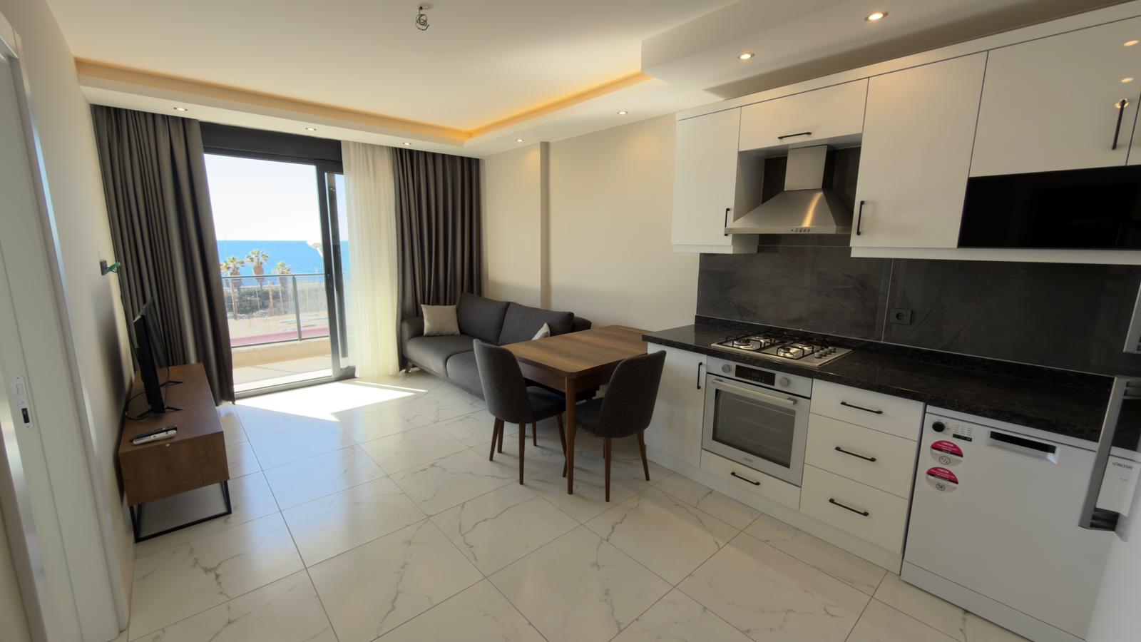 продажа квартиры 1+1 на первой линии моря, Алания