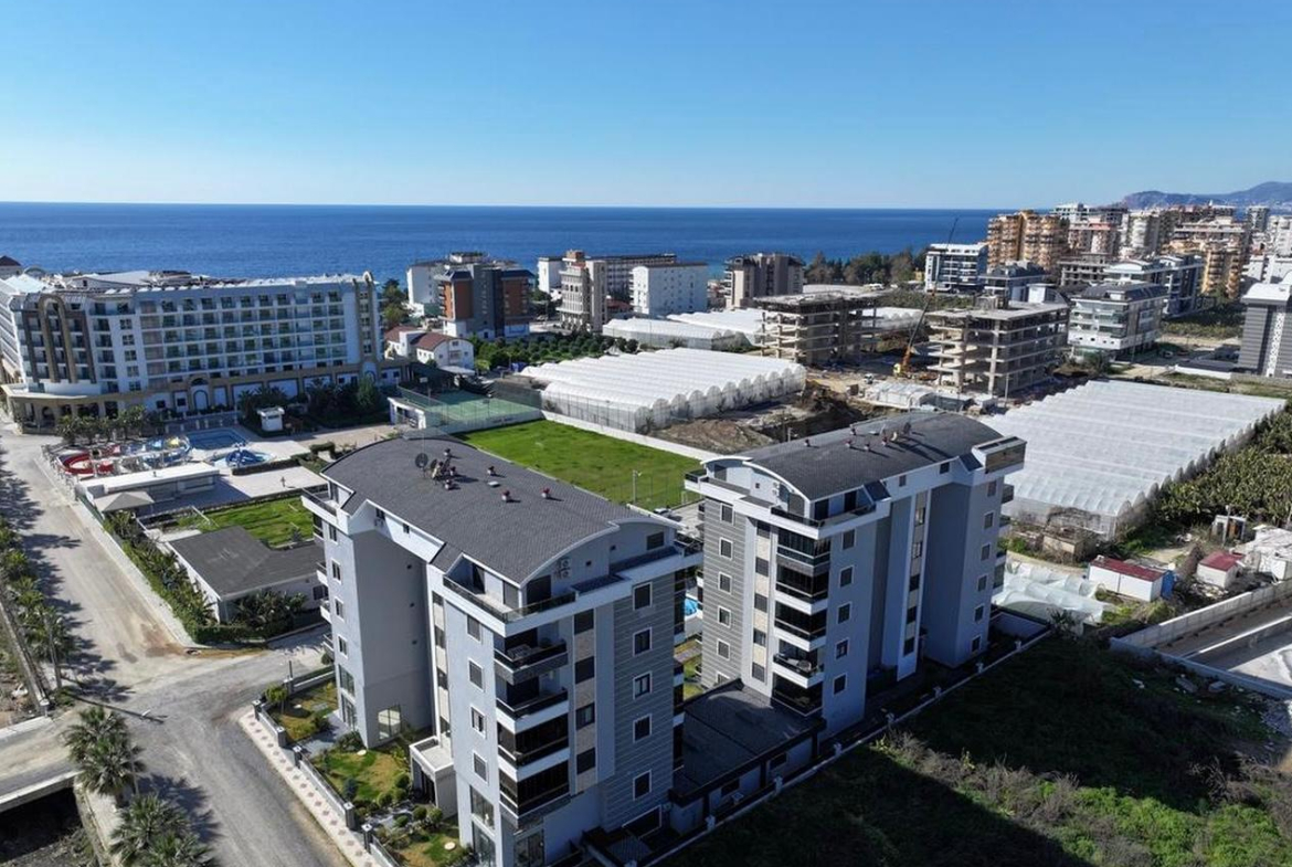 меблированная квартира в комплексе у моря, Алания