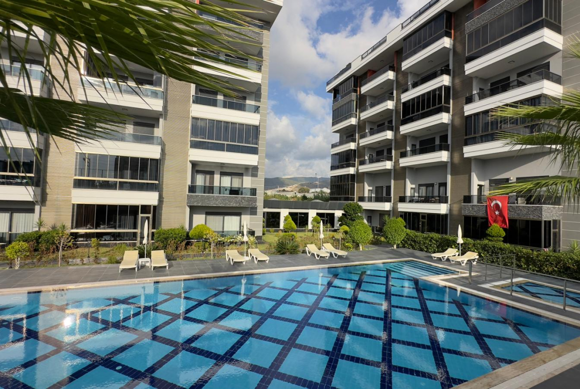 меблированная квартира в комплексе у моря, Алания