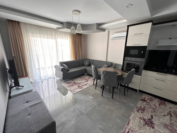 меблированная квартира 1+1 в Махмутларе